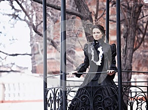 Outdoors portrait of a victorian lady in black