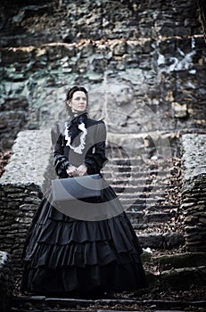 Outdoors portrait of a victorian lady in black