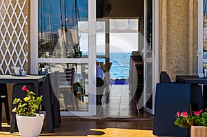 Outdoors restaurant near the waterfront in small town in Spain