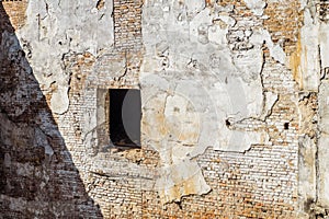 Outdoors surface of old red brick wall with aperture