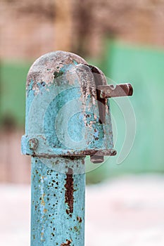 Outdoors wintage old water tap column