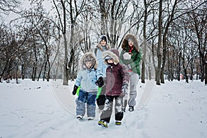 Outdoors winter activities for family, friends. Happy Family, friends, two women, two boy kids and dog, mothers and sons