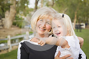 Outdoorsy Grandmother and Granddaughter Playing At The Park
