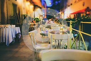 Outdor restaurant terrace at night European city street