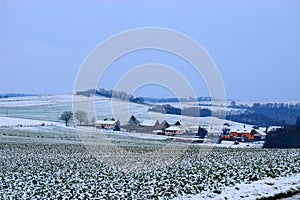 outer part of village Welling with snowy landscape in the Eifel photo