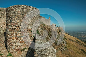 Outer walls and towers over rocky hill at the Marvao Castle