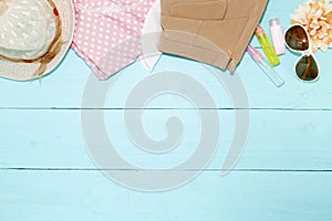 Outfit of clothes and woman accessories on blue wooden backgroun