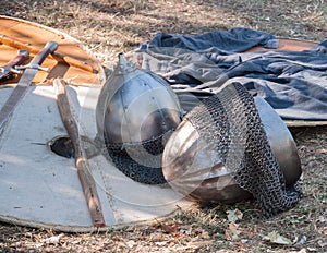 Outfit of a medieval warrior lying picturesquely at a medieval fair. photo