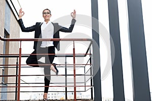 Outgoing female doing exercise outdoor