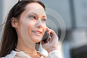 Outgoing woman speaking by phone