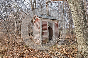 Outhouse Fading from Red to Gray