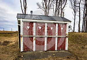 Outhouse toilet with four closed and locked doors