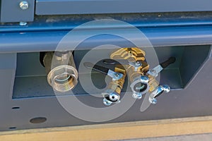 Outlet ball valves on an air compressor close-up