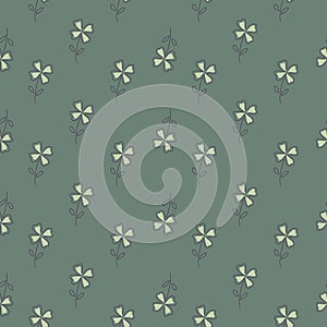 Outline seamless doodle pattern with white simple four-leaf clower print. Pale green background