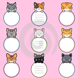 Outlined adorable and simple cat heads with front paws holding a circle note