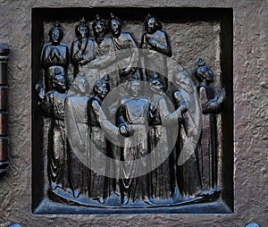 The outpouring of the Holy Spirit on Pentecost, relief on the door of the Grossmunster church in Zurich photo
