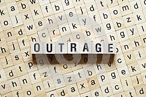 Outrage word concept on cubes