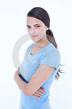 Outraged brunette woman with arms crossed