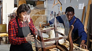 Outraged woman restorer at workshop