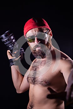Outrageous photographer with a bare chest.