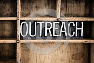 Outreach Concept Metal Letterpress Word in Drawer photo