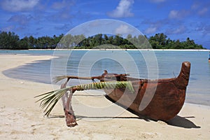 Outrigger on beach photo