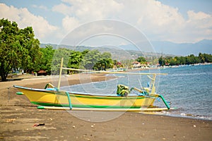 Outrigger boat ot the beach in Lovina, Bali