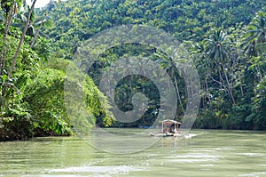 Outrigger boat on a tropical river