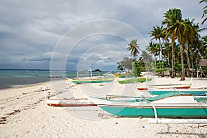 Outrigger boats on tropical beach