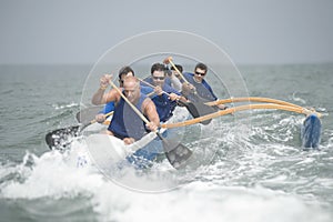 Outrigger Canoeing Team In Race