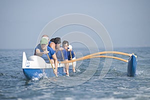 Outrigger Canoeing Team In Race