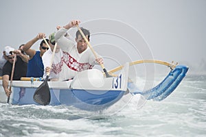 Outrigger Canoeing Team In Race