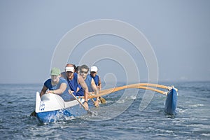 Outrigger Canoeing Team In Race