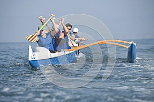 Outrigger Canoeing Team In Race