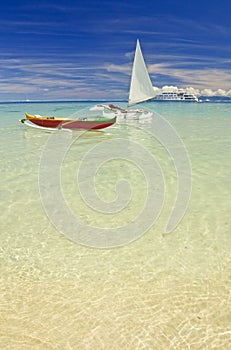 Outrigger canoes on sandy beach