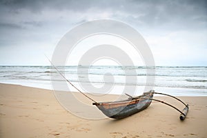 Outrigger under a stormy sky