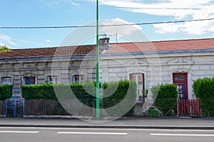 Outside building renovation of ancient old house before and after difference on wash clean and dirty wall home facade