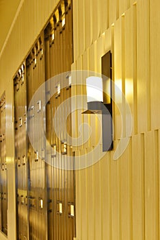 Outside commercial building at night,Wall lamp on the wooden wall,modern shop ,modern business building otside,