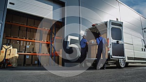 Outside of Logistics Distributions Warehouse: Two Workers Load Delivery Truck with Cardboard