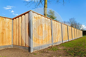 Outside new wooden fence around garden