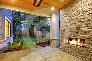 Outside Patio boasts gorgeous stone Fireplace photo