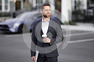 Outside portrait of man in suit. Businessman walking in city. Hispanic man walk on street. Business man with laptop and