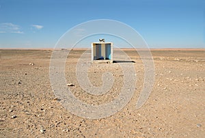 Outside toilet in desert