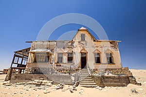 Outside view of one of the abandoned houses in the ghost town of Kolmanskop near LÃ¼deritz in Namibia