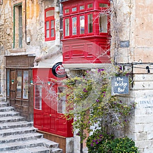 Outside view on the red colored bridge bar on Valetta, Malta near the harbour