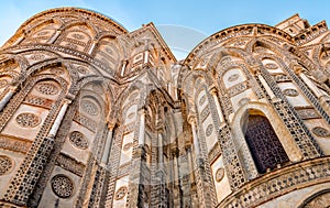 The outsides of the principal doorways and their pointed arches of the ancient Cathedral Church in Monreale, Sicily