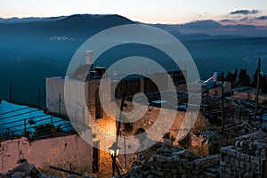 Outskirts of the old town in the evening light and views of Mount Miron.