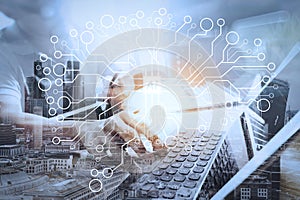 Outsource Developer working on marble Desk Working Laptop Computer Mobile Application Software and digital tablet dock smart