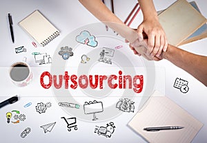 Outsourcing concept. The meeting at the white office table