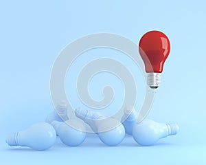 Outstanding light bulbs red in air one different idea from the others on blue pastel background